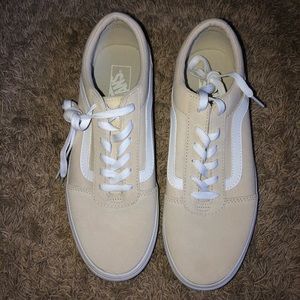 Tan low top Vans sneakers